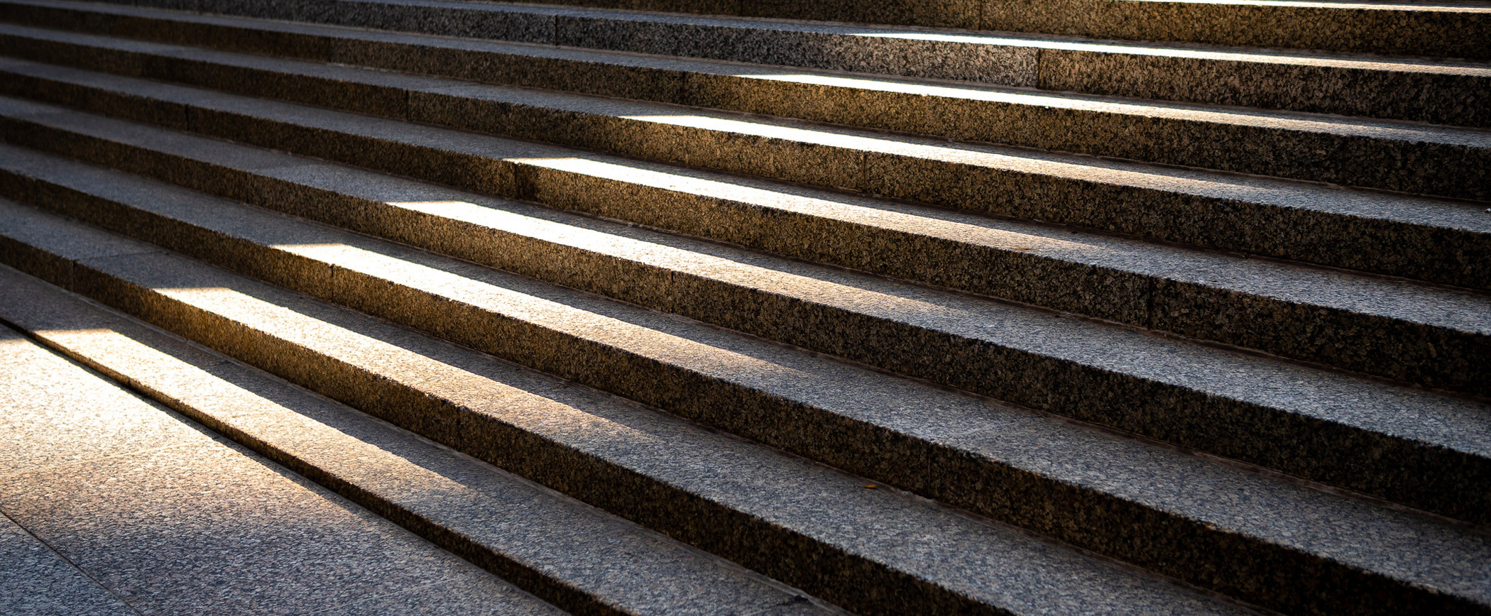 Close-up view of sunlit stone steps.